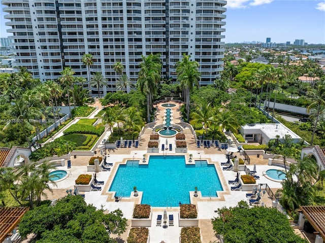 2000 Island Blvd Unit 2409, Aventura, FL 33160 - community pool featuring a city view, a hot tub, and a patio area