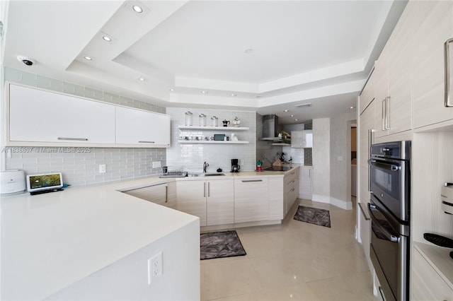 2000 Island Blvd Unit 2409, Aventura, FL 33160 - kitchen featuring a tray ceiling, backsplash, open shelves, light countertops, and light tile patterned floors