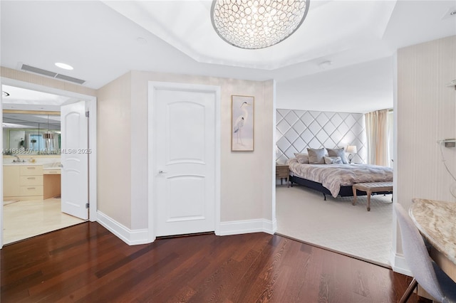 2000 Island Blvd Unit 2409, Aventura, FL 33160 - bedroom featuring wood finished floors and a tray ceiling