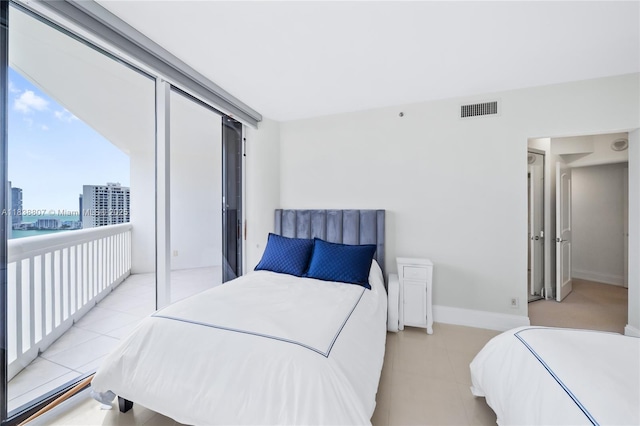 2000 Island Blvd Unit 2409, Aventura, FL 33160 - bedroom with baseboards and light tile patterned floors