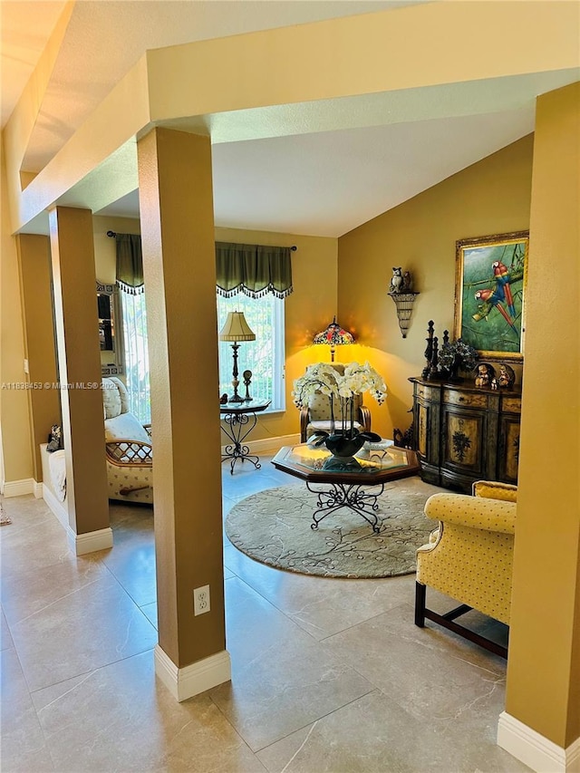 tiled living area featuring baseboards