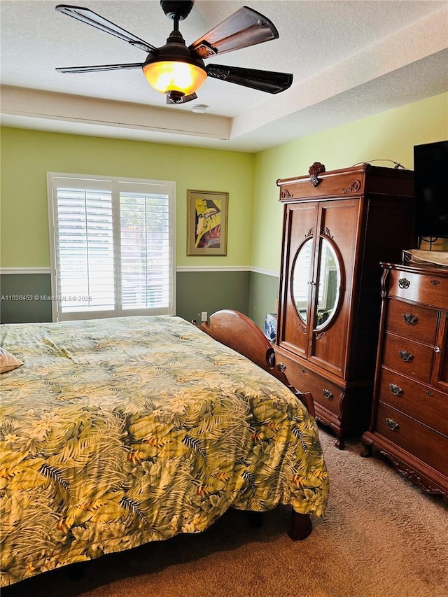 bedroom featuring carpet and a ceiling fan