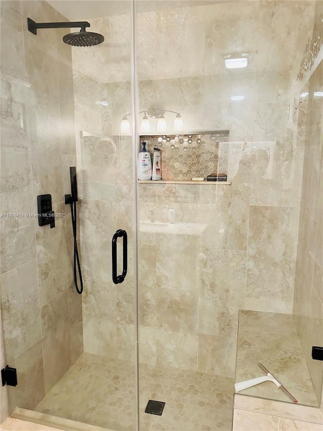 full bath with a shower stall