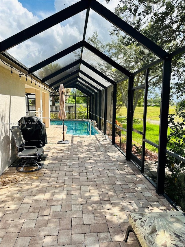 swimming pool with a patio and a lanai