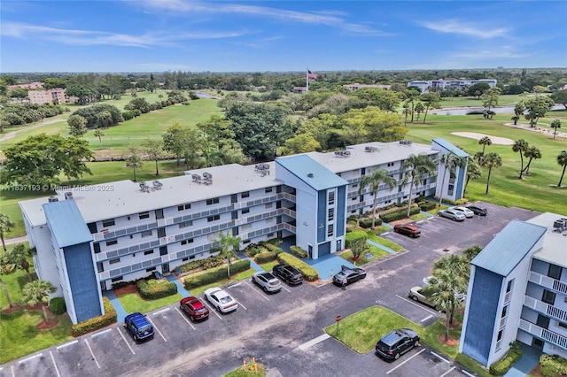 7684 NW 18th St Unit 202, Margate, FL 33063 - drone / aerial view of a golf course and a large body of water