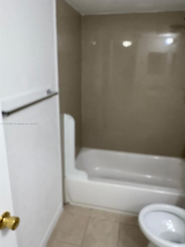 8560 N Sherman Cir Unit 105, Miramar, FL 33025 - full bathroom featuring tile patterned flooring and washtub / shower combination