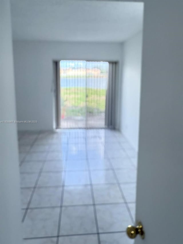 8560 N Sherman Cir Unit 105, Miramar, FL 33025 - empty room with light tile patterned floors