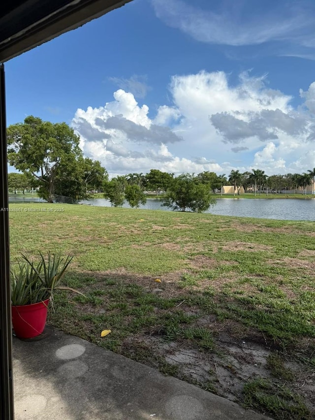 8560 N Sherman Cir Unit 105, Miramar, FL 33025 - view of grassy yard featuring a water view