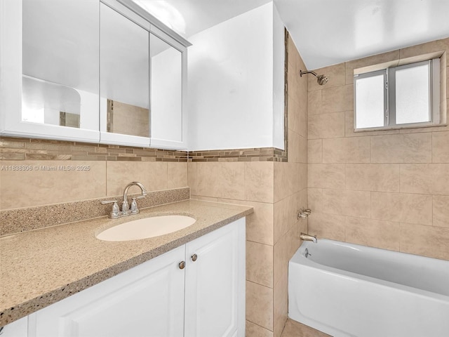 1170 NE 191st St Unit 24, Miami, FL 33179 - bathroom featuring tub / shower combination, vanity, and tile walls