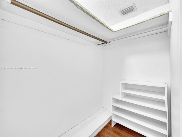 1170 NE 191st St Unit 24, Miami, FL 33179 - walk in closet with wood finished floors