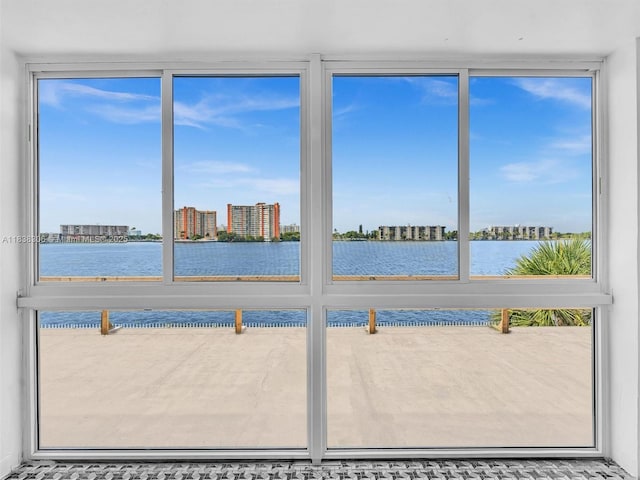 1170 NE 191st St Unit 24, Miami, FL 33179 - unfurnished sunroom with a water view and a view of city