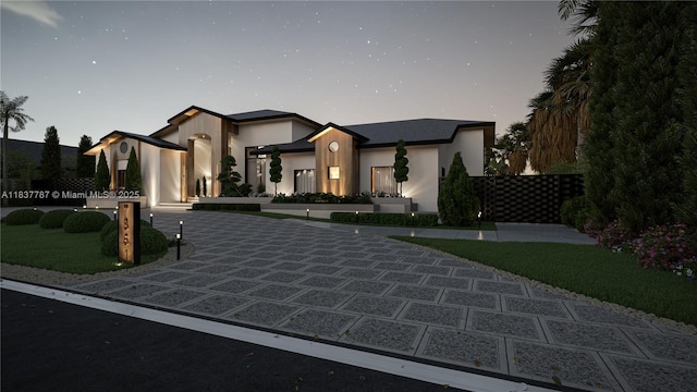 7861 SW 181st Ter, Palmetto Bay, FL 33157 - view of front of property with stucco siding and curved driveway