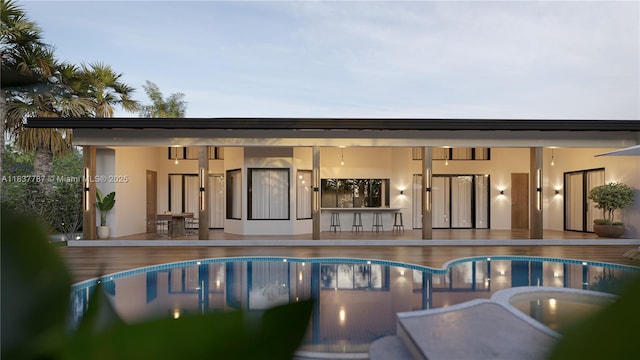 7861 SW 181st Ter, Palmetto Bay, FL 33157 - rear view of house with stucco siding, an indoor pool, and a patio
