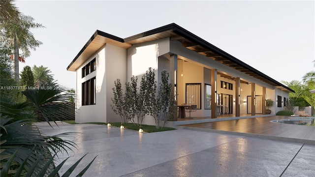 7861 SW 181st Ter, Palmetto Bay, FL 33157 - view of home's exterior featuring stucco siding, a patio area, and ceiling fan