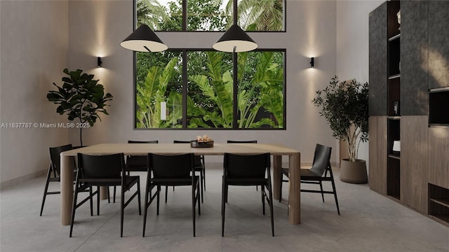 7861 SW 181st Ter, Palmetto Bay, FL 33157 - dining room featuring a high ceiling and concrete flooring