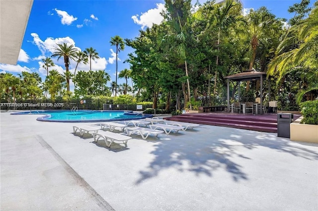 1450 Brickell Bay Dr Unit 1402, Miami, FL 33131 - community pool featuring a patio area, a gazebo, and a deck