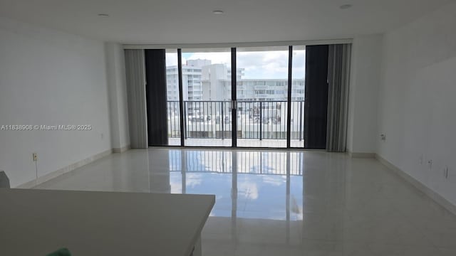 1450 Brickell Bay Dr Unit 1402, Miami, FL 33131 - empty room with floor to ceiling windows and baseboards