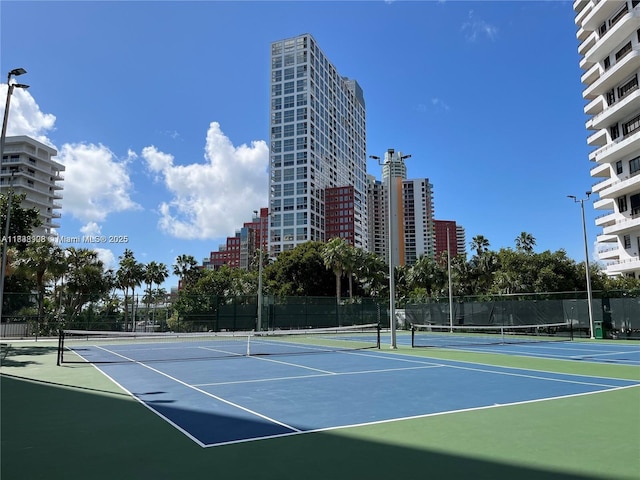 1450 Brickell Bay Dr Unit 1402, Miami, FL 33131 - view of tennis court with community basketball court and a city view