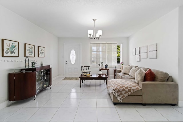 5723 NW 86th Ave, Tamarac, FL 33321 - living room featuring a chandelier and baseboards