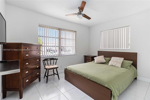 5723 NW 86th Ave, Tamarac, FL 33321 - bedroom featuring baseboards and a ceiling fan