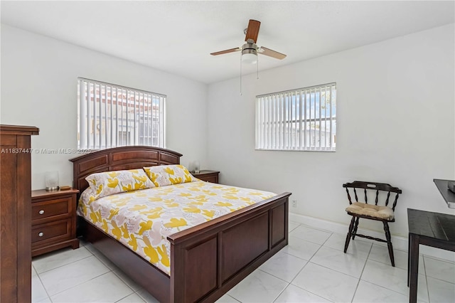 5723 NW 86th Ave, Tamarac, FL 33321 - bedroom with multiple windows, a ceiling fan, and light tile patterned floors