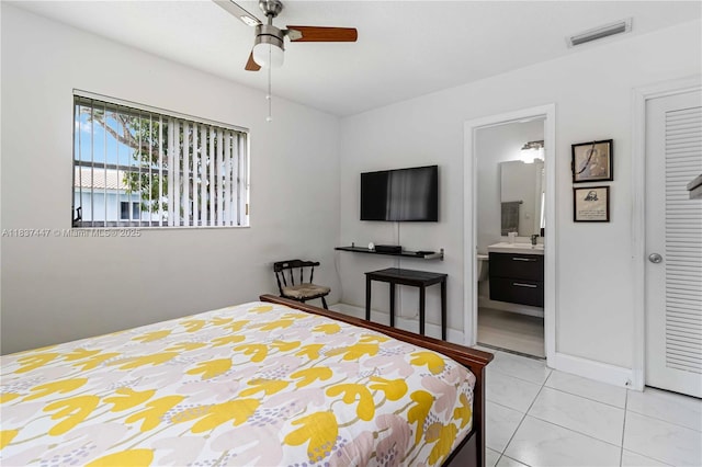 5723 NW 86th Ave, Tamarac, FL 33321 - bedroom with ensuite bath, ceiling fan, and light tile patterned flooring