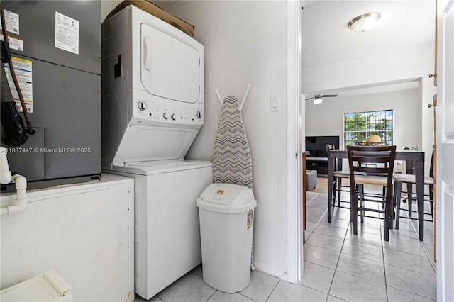 5723 NW 86th Ave, Tamarac, FL 33321 - laundry area with stacked washing machine and dryer, light tile patterned floors, ceiling fan, and heating unit