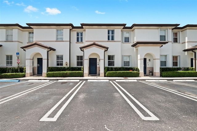 8079 W 36th Ave Unit 6, Hialeah, FL 33018 - view of front of house featuring stucco siding and uncovered parking