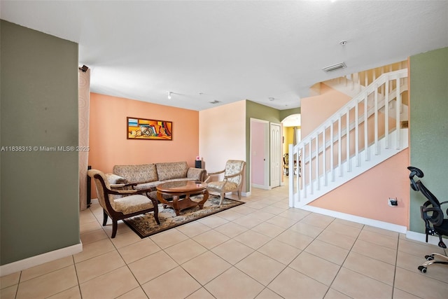 8079 W 36th Ave Unit 6, Hialeah, FL 33018 - living room with stairs, light tile patterned floors, and arched walkways