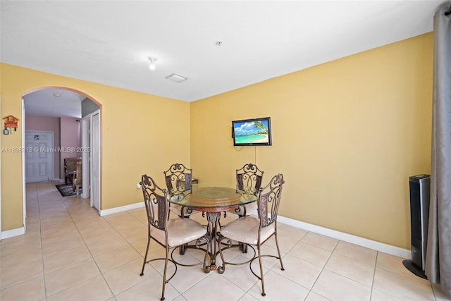 8079 W 36th Ave Unit 6, Hialeah, FL 33018 - dining room featuring arched walkways and light tile patterned flooring