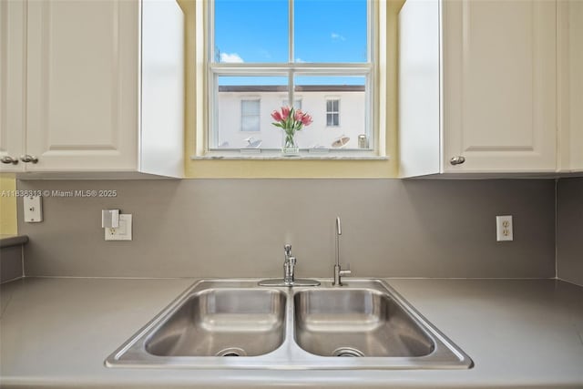 8079 W 36th Ave Unit 6, Hialeah, FL 33018 - kitchen featuring light countertops and white cabinetry