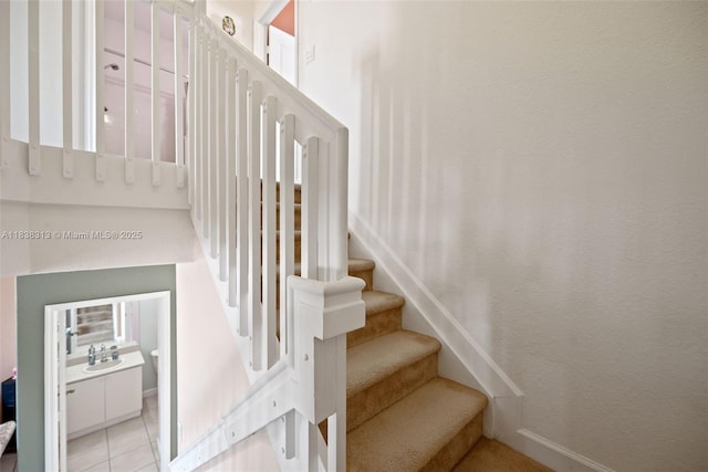 8079 W 36th Ave Unit 6, Hialeah, FL 33018 - staircase with baseboards and tile patterned flooring