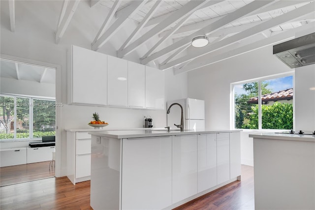 5308 Riviera Dr, Coral Gables, FL 33146 - kitchen with modern cabinets, freestanding refrigerator, white cabinets, beam ceiling, and high vaulted ceiling