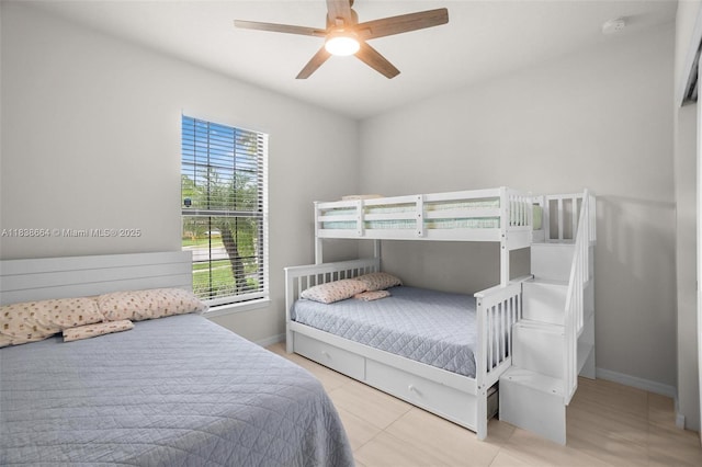 8036 NW 78th St, Tamarac, FL 33321 - tiled bedroom with baseboards and ceiling fan