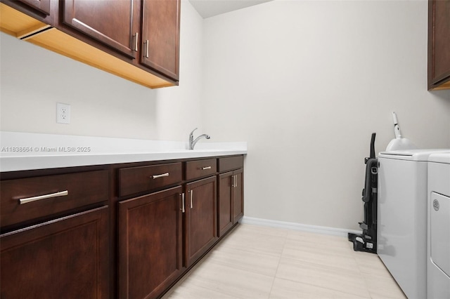 8036 NW 78th St, Tamarac, FL 33321 - washroom with washing machine and dryer and cabinet space