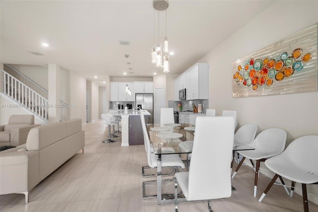 8036 NW 78th St, Tamarac, FL 33321 - dining space with stairs, a chandelier, and recessed lighting