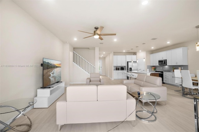 8036 NW 78th St, Tamarac, FL 33321 - living room featuring a ceiling fan, recessed lighting, and stairs