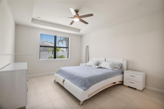 8036 NW 78th St, Tamarac, FL 33321 - bedroom with a raised ceiling, ceiling fan, and light tile patterned floors