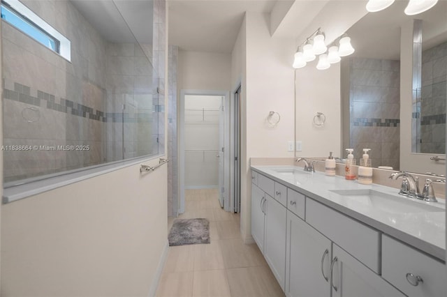 8036 NW 78th St, Tamarac, FL 33321 - full bathroom featuring double vanity, walk in shower, tile patterned floors, and a spacious closet