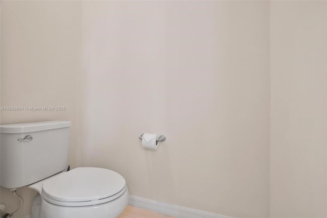 8036 NW 78th St, Tamarac, FL 33321 - bathroom featuring baseboards and toilet