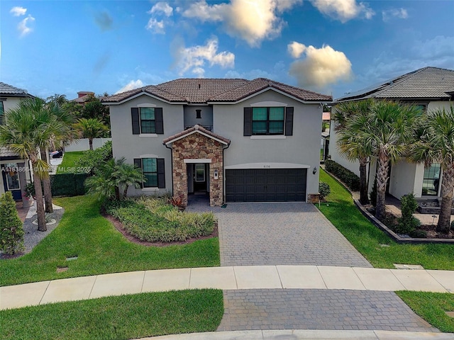 8036 NW 78th St, Tamarac, FL 33321 - view of front of house with stucco siding, stone siding, decorative driveway, a garage, and a tiled roof