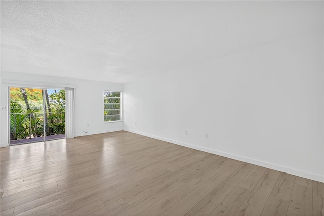 1821 Jefferson Ave Unit 202, Miami Beach, FL 33139 - empty room with wood finished floors and a textured ceiling