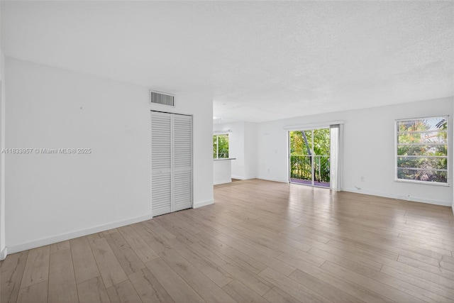 1821 Jefferson Ave Unit 202, Miami Beach, FL 33139 - unfurnished room with wood finished floors and a textured ceiling