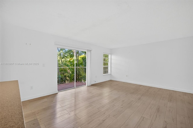 1821 Jefferson Ave Unit 202, Miami Beach, FL 33139 - spare room featuring baseboards and wood finished floors