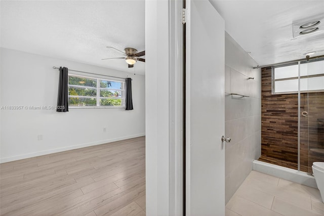 1821 Jefferson Ave Unit 202, Miami Beach, FL 33139 - bathroom featuring a shower stall, a ceiling fan, and wood finished floors