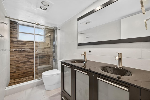 1821 Jefferson Ave Unit 202, Miami Beach, FL 33139 - full bathroom with tile walls, a shower stall, double vanity, and tile patterned flooring