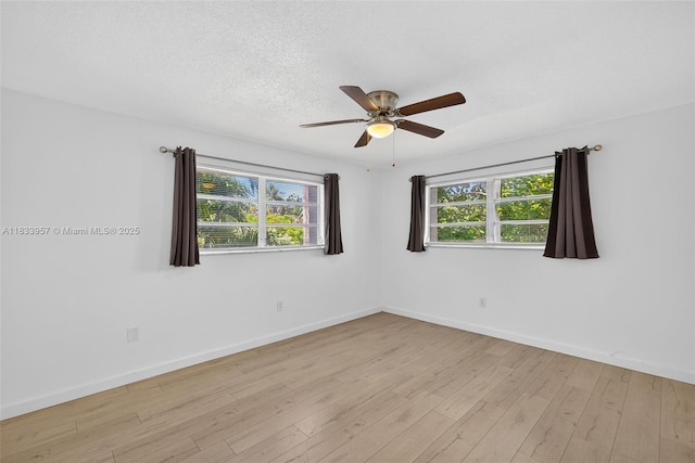 1821 Jefferson Ave Unit 202, Miami Beach, FL 33139 - empty room featuring a ceiling fan, light wood finished floors, and a textured ceiling