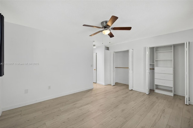 1821 Jefferson Ave Unit 202, Miami Beach, FL 33139 - unfurnished bedroom with multiple closets, light wood finished floors, and ceiling fan