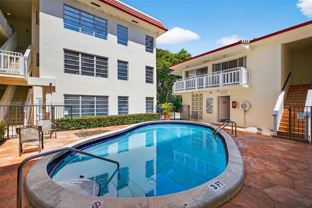 1821 Jefferson Ave Unit 202, Miami Beach, FL 33139 - community pool featuring stairs and a patio