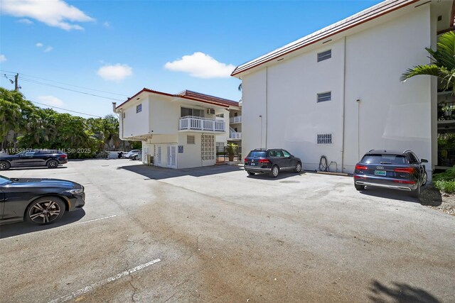 1821 Jefferson Ave Unit 202, Miami Beach, FL 33139 - view of building exterior featuring uncovered parking